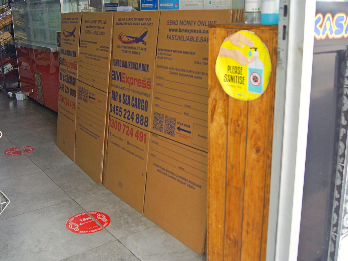 Balikbayan boxes being loaded for shipping to the Philippines